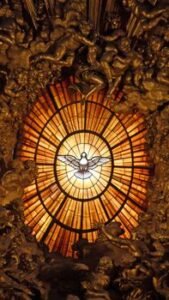 Intricate stained glass window depicting the Holy Spirit as a dove, located in St. Peter's Basilica.